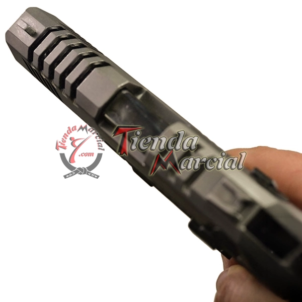 Detalle de la corredera superior de la pistola de fogueo Blow TR92K calibre 9 mm Magnum con acabado bicolor para entrenamiento y colección en Colombia.